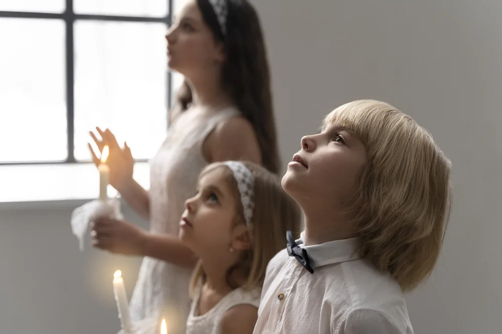 Children praying together in church