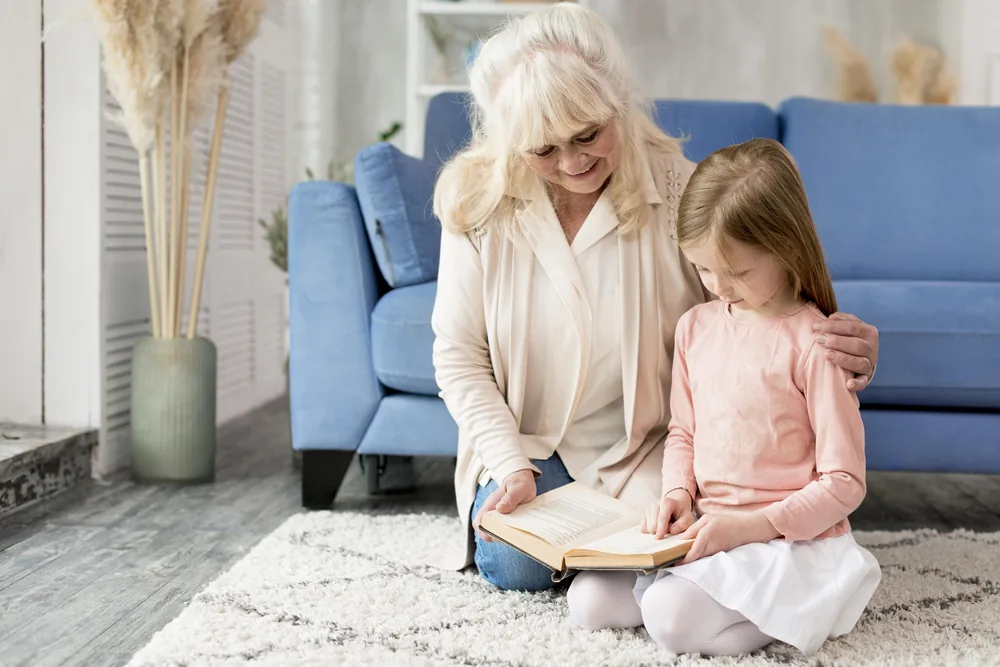 Grandmother praying with her grandchild
