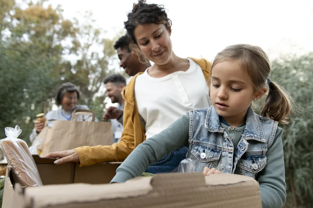 Church volunteers with children at a community event